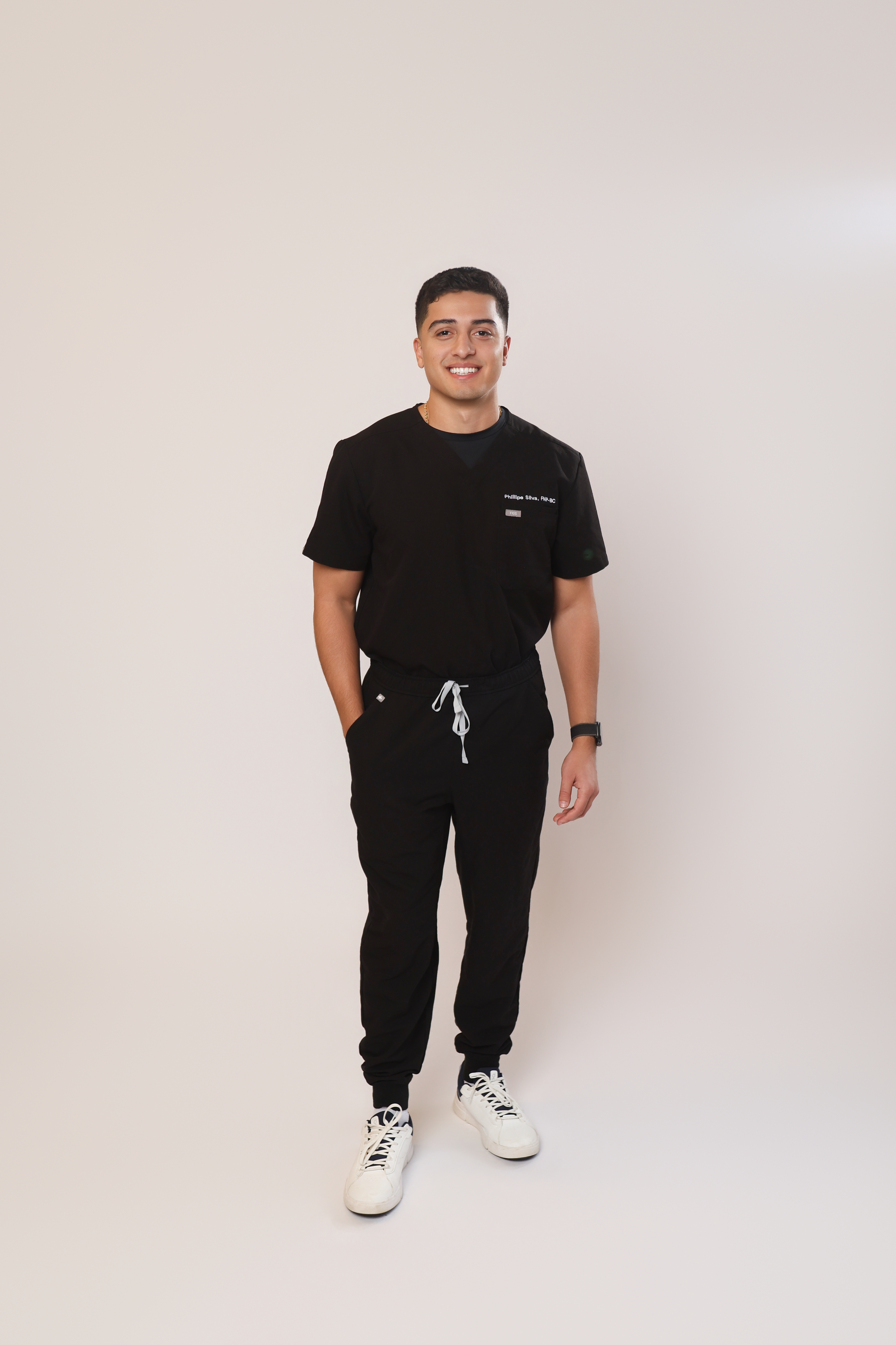 Phillipe Silva, Family Nurse Practitioner, wearing black scrubs